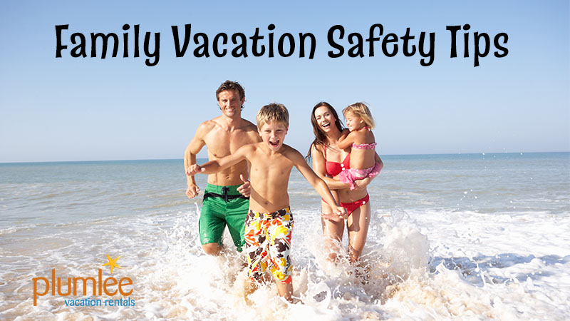 Family Vacation Safety Tips article header showing a family running in the water at the beach
