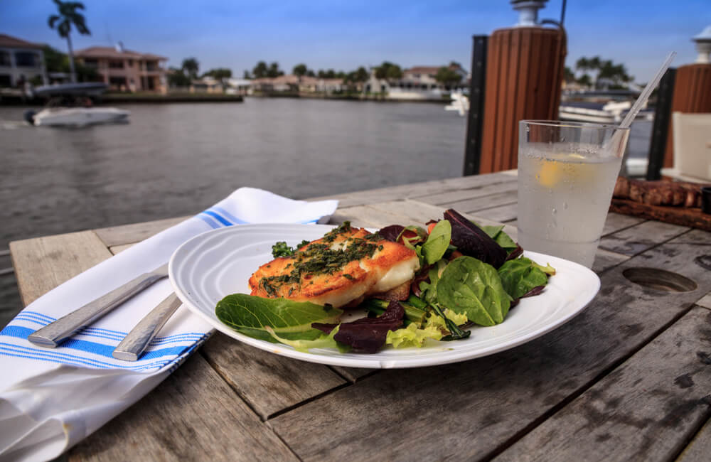 Photo of restaurant overlooking the water at Johns Pass Village