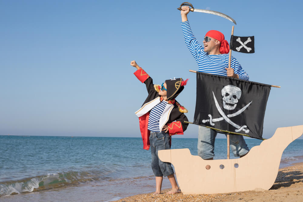 Photo of parent and child pretending to be Florida pirates on the Gulf Coast