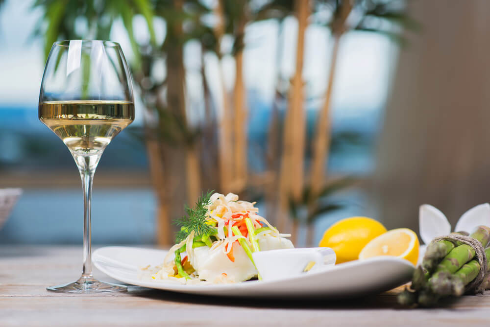 Photo of plate of seafood and wine at Indian Rocks Beach seafood restaurant