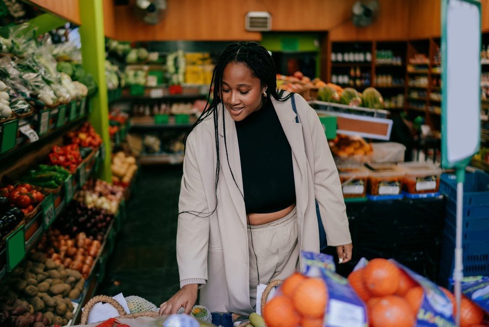 Person picking out produce at an Indian Rocks Beach grocery store