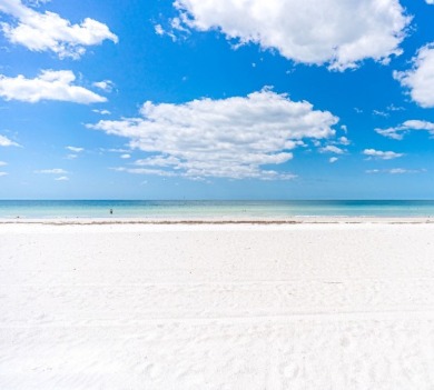 White puffy clouds, white sand beach, Gulf of Mexico waters | Plumlee Vacation Rentals