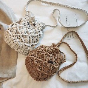 Two crocheted bucket bag purses; one white, white tan | Plumlee Vacation Rentals in Indian Rocks Beach, FL