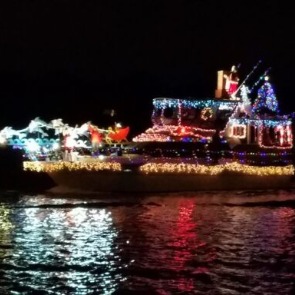 Holiday lighted boat in Indian Rocks Beach, Florida | Plumlee Gulf Beach Vacation Rentals