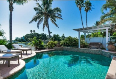 Ohana House Vacation Rental on the Intracoastal Waterway with private backyard oasis and pool | Plumlee Vacation Rentals in Indian Rocks Beach Florida