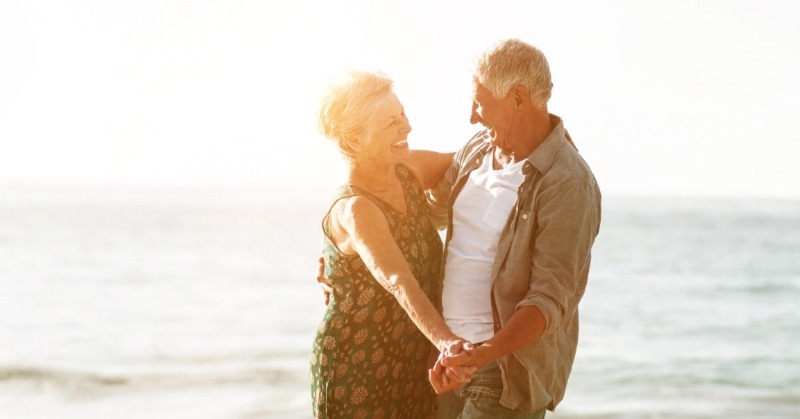 couple dancing on the beach | Plumlee Realty