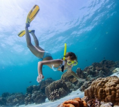 woman snorkeling in the ocean | Plumlee Gulf Beach Realty