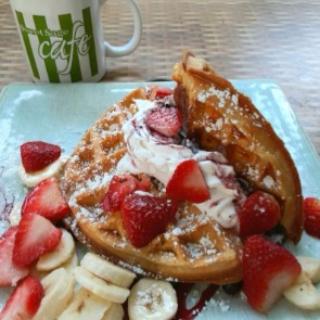 Classic Belgian Waffle Piled High with Fresh Fruit and Homemade Whipped Cream at Sweet Sage Cafe | Plumlee Indian Rocks Beach Rentals