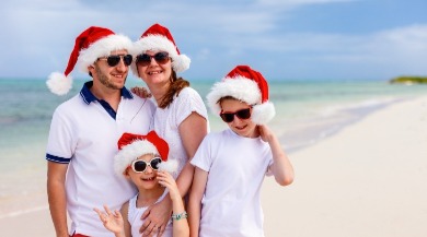 family on the beach at christmas | Plumlee Vacation Rentals