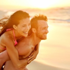 couple on beach | Plumlee Vacation Rentals