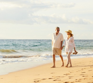 couple walking on the beach |Plumlee Vacation Rentals
