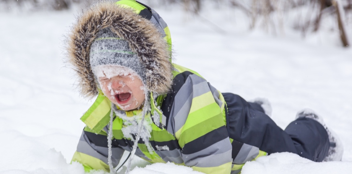 Little boy crying with a face full of snow | Plumlee Vacations Indian Rocks Beach Rentals