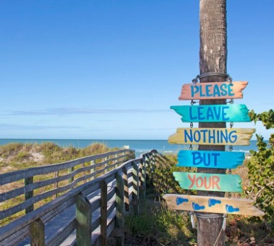 Please Leave Nothing Behind But Your Footprints Sign in Indian Rocks Beach, Florida | Plumlee Indian Rocks Beach Vacation Rentals
