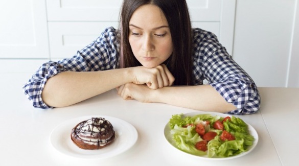 Woman contemplating a dessert or a salad | Plumlee Indian Rocks Beach rentals