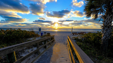 Indian Rocks Beach walkway leading to the Gulf of Mexico at sunset | Plumlee Indian Rocks Beach Condo Rentals