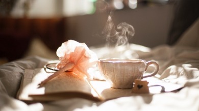 tea and journal on bed | Plumlee Vacation Rentals