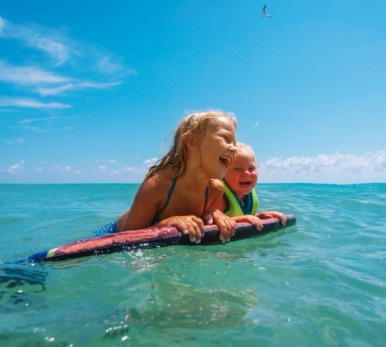Water Safety Tips: Kids floating in Gulf of Mexico with a buddy | Plumlee Indian Rocks Beach Vacation Rentals