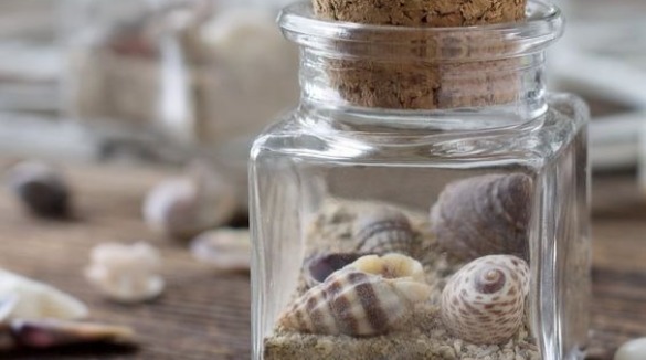 Simple Square Jar Filled with Sand and Shells | Plumlee Indian Rocks Beach Vacation Rentals