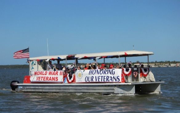 Veterans Boat Decorated for Parade | Plumlee Realty
